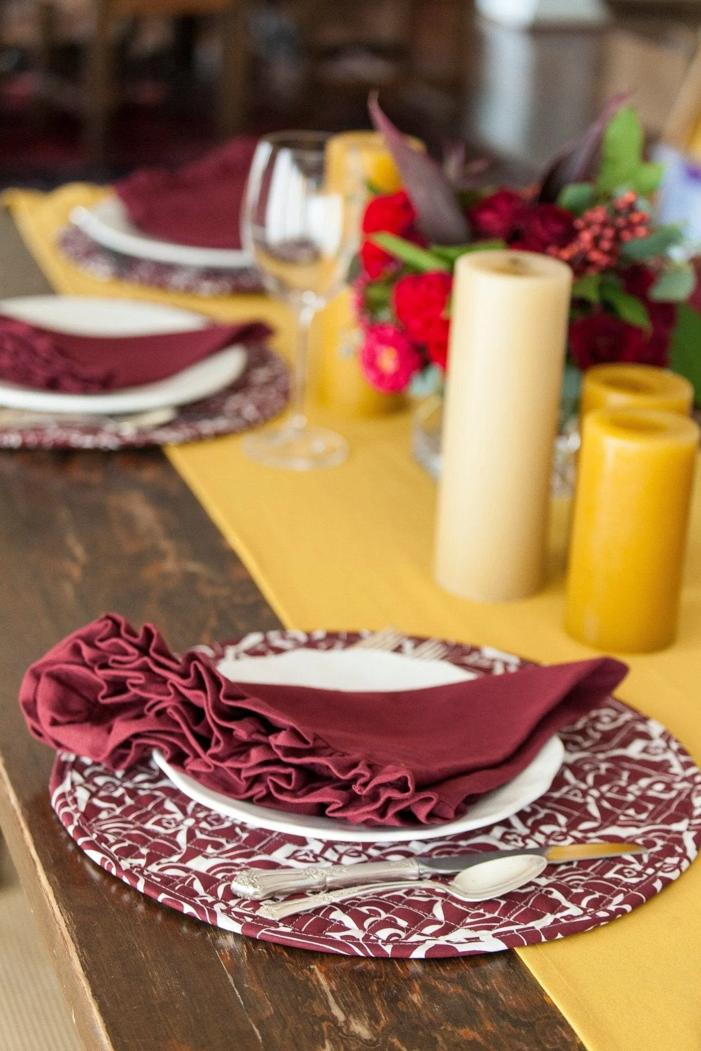filigree claret red reversible greek key licorice black printed round quilted cloth placemats